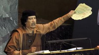 Moammar Qadafi gestures during his speech at the United Nations General Assembly in New York.