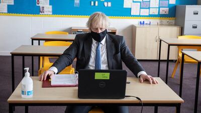 Boris Johnson takes part in an online class during his visit. Reuters