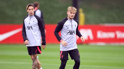 Liverpool's Harvey Elliott, right and Kostas Tsimikas at the AXA Training Centre. Reuters