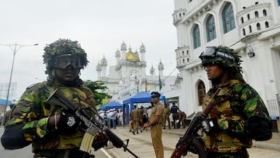 Security personnel stand guard outside a mosque in Colombo, Sri Lanka. AFP