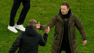 Solskjaer (L) congratulates Leipzig coach Julian Nagelsmann after the final whistle. AFP