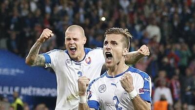 Peter Pekarik and Martin Skrtel (rear) of Slovakia celebrate at the final whistle of the UEFA EURO 2016 group B preliminary round match between Russia and Slovakia at Stade Pierre Mauroy in Lille, France, 15 June 2016. Slovakia won 2-1. EPA/LAURENT DUBRULE