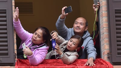 People take pictures as Pope Francis leaves at the end of a pastoral visit in Cesena, Italy. Alberto Lingria / Reuters
