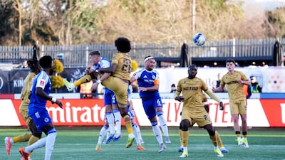 Macclesfield 's Paul Dawsonheads home the opening goal. PA