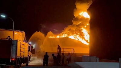 Firefighters work to control the blaze at an oil refinery in Zawiya, Libya, following drone attacks on August 10. Reuters