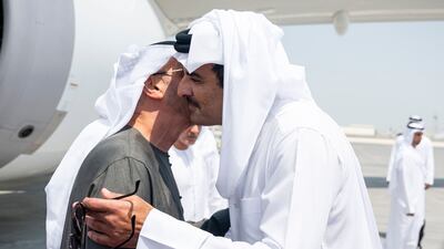 President Sheikh Mohamed is greeted by Sheikh Tamim on his arrival at Doha International Airport. Abdulla Al Bedwawi / UAE Presidential Court