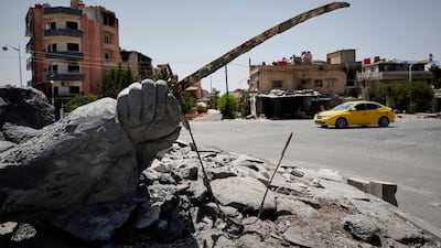 A destroyed statue in the Druze-majority Sweida city, the scene of heavy violence four months ago. AP