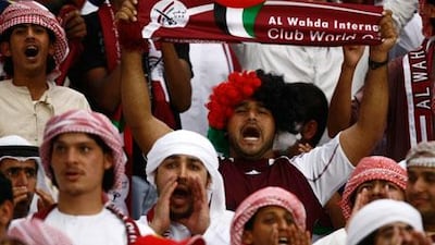 Fans cheer for Al Wahda football club prior to the Presidents Cup Final Match between Al Jazira and AL Wahda. The UAE football league scored well in a survey of what fans enjoy to watch.