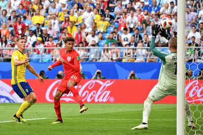 Dele Alli heads home England's second goal against Sweden in the 2018 World Cup quarter-final in Russia. AFP