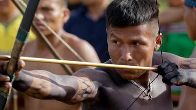 An Embera indigenous man takes part in an archery competition. AP