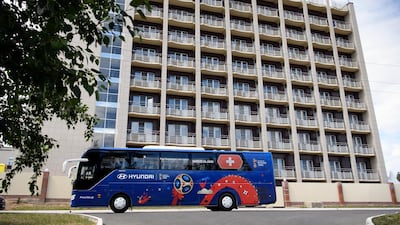 The Switzerland team bus drives in front of the Lada Resort Hotel, Switzerland's team base camp, in Togliatti, Russia. EPA
