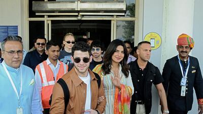 Bollywood actress Priyanka Chopra and singer Nick Jonas wave as they arrive at the airport in ahead of their wedding on November 29, 2018. Photo: Reuters