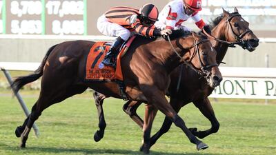 Little Mike, left, ridden by Mike Smith, wins the Grade 1 Joe Hirsch Turf Classic Invitational at Belmont Park. AP Photo