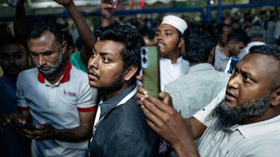 Bangladeshis watch as election results are announced in the capital. Getty Images