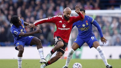 Romeo Lavia, left, and Levi Colwill of Chelsea vie for the ball with Bryan Mbeumo of Manchester United. EPA
