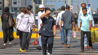 Companies in the UAE are balancing rising costs with the need to retain key talent. Victor Besa / The National