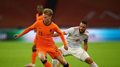 Netherlands midfielder Frenkie de Jong on the ball under pressure from Spain midfielder Koke. Getty Images