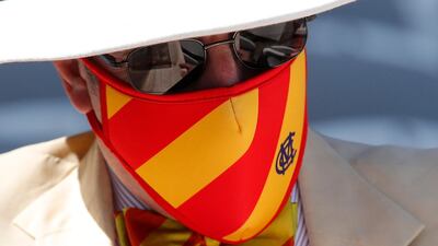 An MCC member wearing a protective face mask at Lord's. Reuters