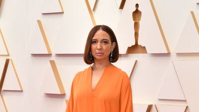 Maya Rudolph, wearing a feathered orange dress. AFP