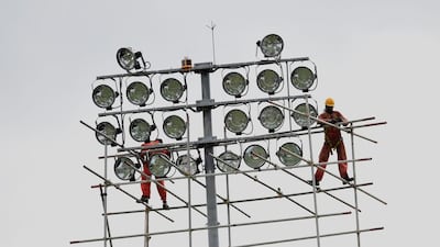 Workers set up lighting at The Rangiri Dambulla International Cricket stadium in Dambulla for the third ODI between Sri Lanka and Australia. Ishara S Kodikara / AFP Photo