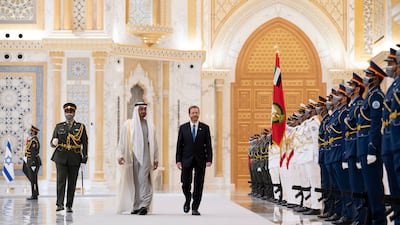 Sheikh Mohamed and Isaac Herzog inspect the UAE honour guard at Qasr Al Watan. Mohamed Al Hammadi / Ministry of Presidential Affairs