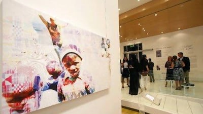 Alia Rashid al Shamsi's Our Last Days As Children, part of an inaugural exhibition and charity auction at the Ara Gallery. The artwork is one of a series by Emirati artists who drew inspiration from photographs taken by youngsters in Lesotho, southern Africa. Jeffrey E Biteng / The National