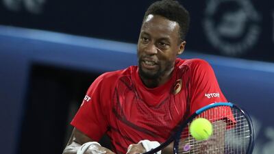 Gael Monfils of France returns the ball to Japan's Yasutaka Uchiyama in Dubai. AP