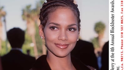 Halle Berry, in a satin maxi with lace-trimmed overlay, attends the 4th annual Blockbuster Awards in Los Angeles, California, on March 10, 1998. Getty Images