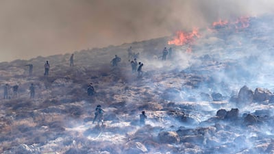 The blaze is threatening to engulf the area. AFP