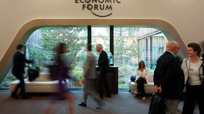Participants walk through the Davos Congress Centre, the venue of the annual meeting. AP