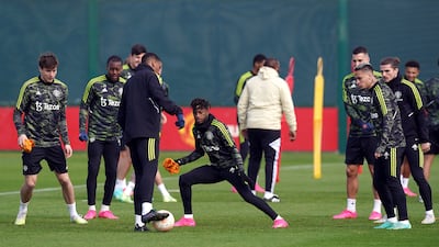 Manchester United's Fred with teammates during training. PA