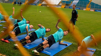 Aaron Mooy, second from left, and his Socceroos teammates are hard at work ahead of their World Cup play-off. Orlando Sierra / AFP