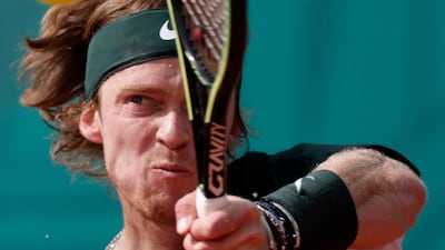 Russia's Andrey Rublev returns the ball to Novak Djokovic. AFP