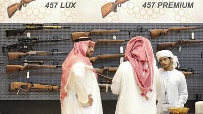 Visitor look at guns at the Bynuna stand during Adihex. Pawan Singh / The National