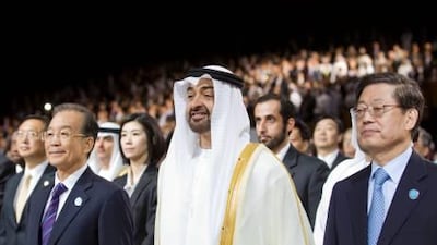 Sheikh Mohammed, Crown Prince of Abu Dhabi and Deputy Supreme Commander of the UAE Armed Forces, joins Wen Jiabao, the Chinese premier, left, and Kim Hwang-sik, South Korea's prime minister, at the opening ceremony of the World Future Energy Summit yesterday.