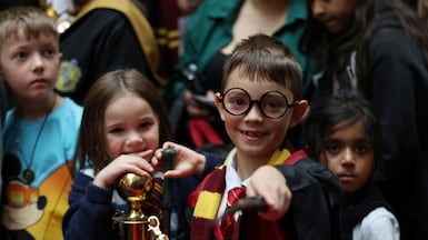 A Harry Potter fan in London holds a wand during Back to Hogwarts Day, held annually on September 1. Reuters