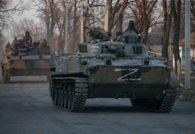 Russian servicemen drive armoured vehicles in Volnovakha, near Donetsk, Ukraine. EPA