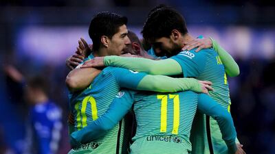 Lionel Messi, left, of Barcelona celebrates scoring their third goal with teammates Luis Suarez, left, Neymar, second right, and Andre Gomes, right. Gonzalo Arroyo Moreno / Getty Images