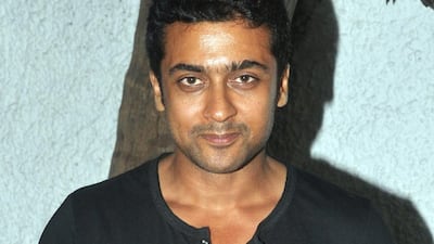 Indian actor Surya poses for a photograph during a screening of Sri Lankan film ëInamí, written, directed and produced by Santosh Sivan in Mumbai on late March 26, 2014. STR / AFP