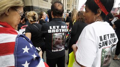 Iraqis and supporters rally outside the Theodore Levin United States Courthouse,on June 21, 2017, in Detroit, wherea hearing began on a lawsuit that seeks to stop the government from deporting more than 100 Iraqi national. s. The American Civil Liberties Union filed the lawsuit in federal court in Detroit against US Immigration and Customs Enforcement seeking a temporary stay of deportations. Carlos Osorio / AP
