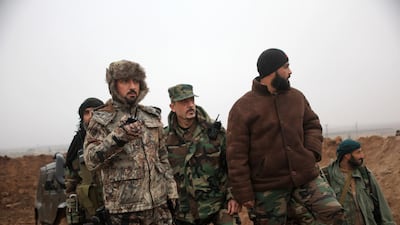 Syrian warlord Suheil AL Hassan (L), a member of a new generation of regime enforcers, in northern Syria, on January 7, 2016 AFP