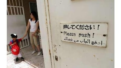 Khalifa, aged three, goes home after another day at the Japanese School in Abu Dhabi.