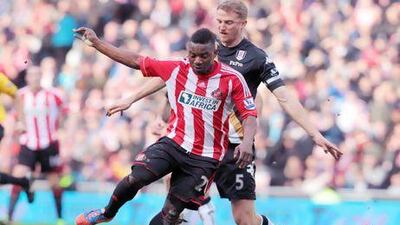 Sunderland's Stephane Sessegnon, front, is challenged by Fulham's Brede Hangeland during their match on Saturday. It ended in a 2-2 draw. Lindsey Parnaby / AFP