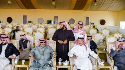 Camel owners sit together at the festival. Maxime Fossat for The National