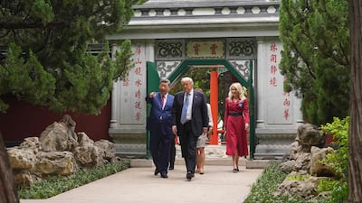 Mr Trump and Mr Xi tour the compound. AFP