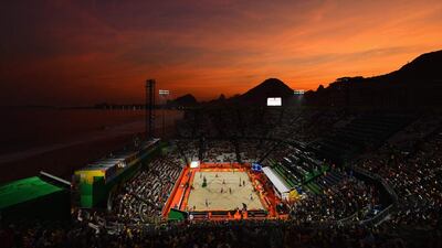 The sun sets on the beach volleyball arena on the first day of the Rio Olympics. Quinn Rooney / Getty Images