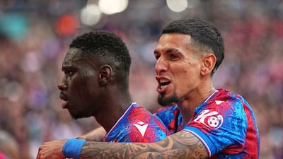 Crystal Palace's Ismaila Sarr, left, celebrates with Daniel Munoz after scoring in London on Saturday. AP