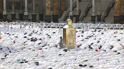A security guard keeps watch as worshippers pray around the Kaaba, Islam's holiest shrine, at the centre of the Grand Mosque. AFP