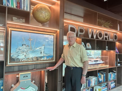 Robert Woods in front of a painting of the Dwarka at DP World Europe headquarters. Dwarka was part of the British India Steam Navigation Company, which later became part of P&O. DP World acquired P&O in 2006. Mr Woods is a P&O veteran and now an independent non-executive director at DP World. Photo: ©DP World / P&O Heritage