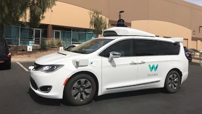 A Waymo self-driving vehicle is parked outside the Alphabet company's offices in Arizona. The company says its driverless vehicles would not have hit pedestrian killed in Uber collision. Heather Somerville/Reuters